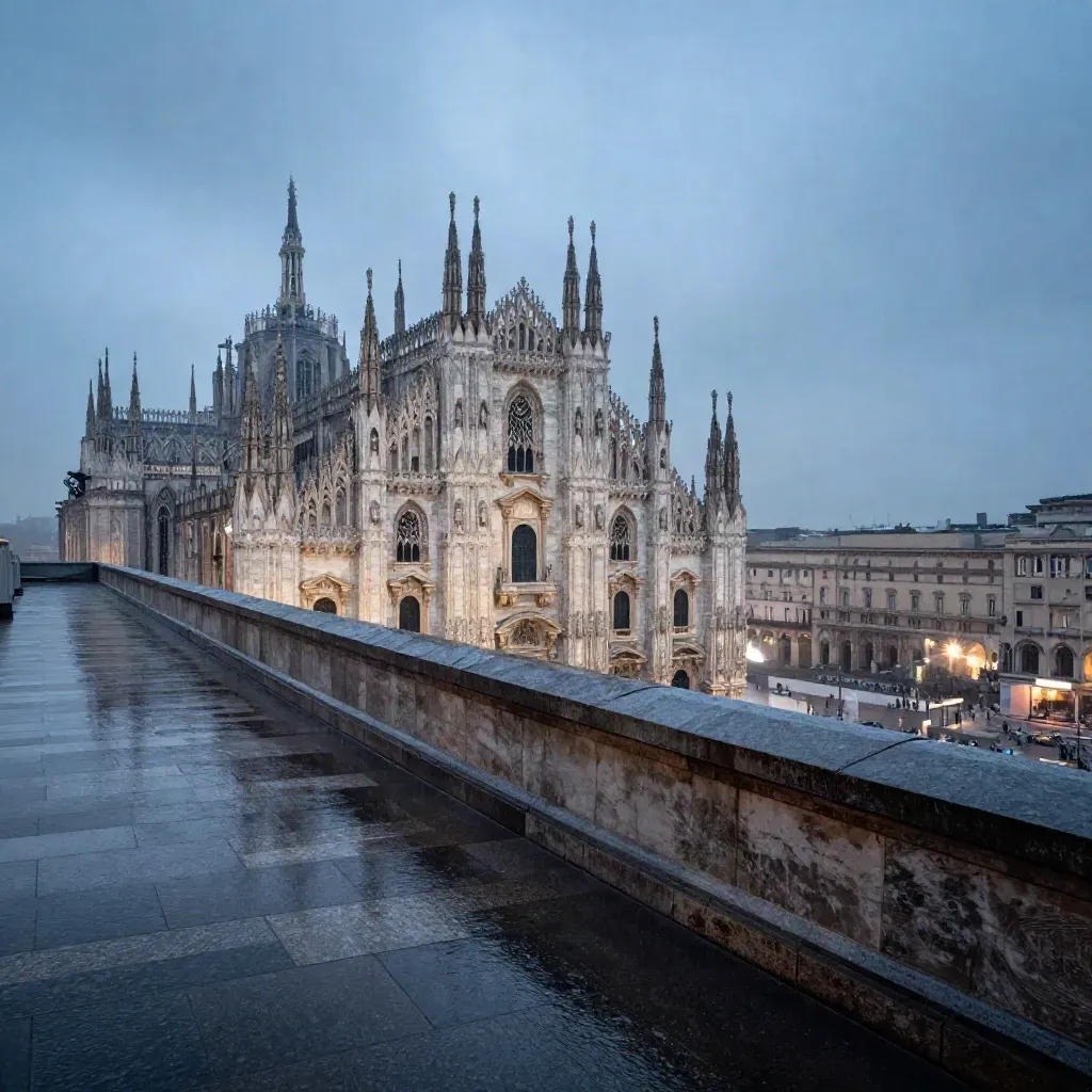 Veduta di Milano dal rooftop al crepuscolo, Duomo in alto e terrazza bagnata in primo piano.